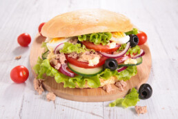 Pan Pagnat a typical French Riviera sandwich, round bread with salad, tuna, tomatoes, olives